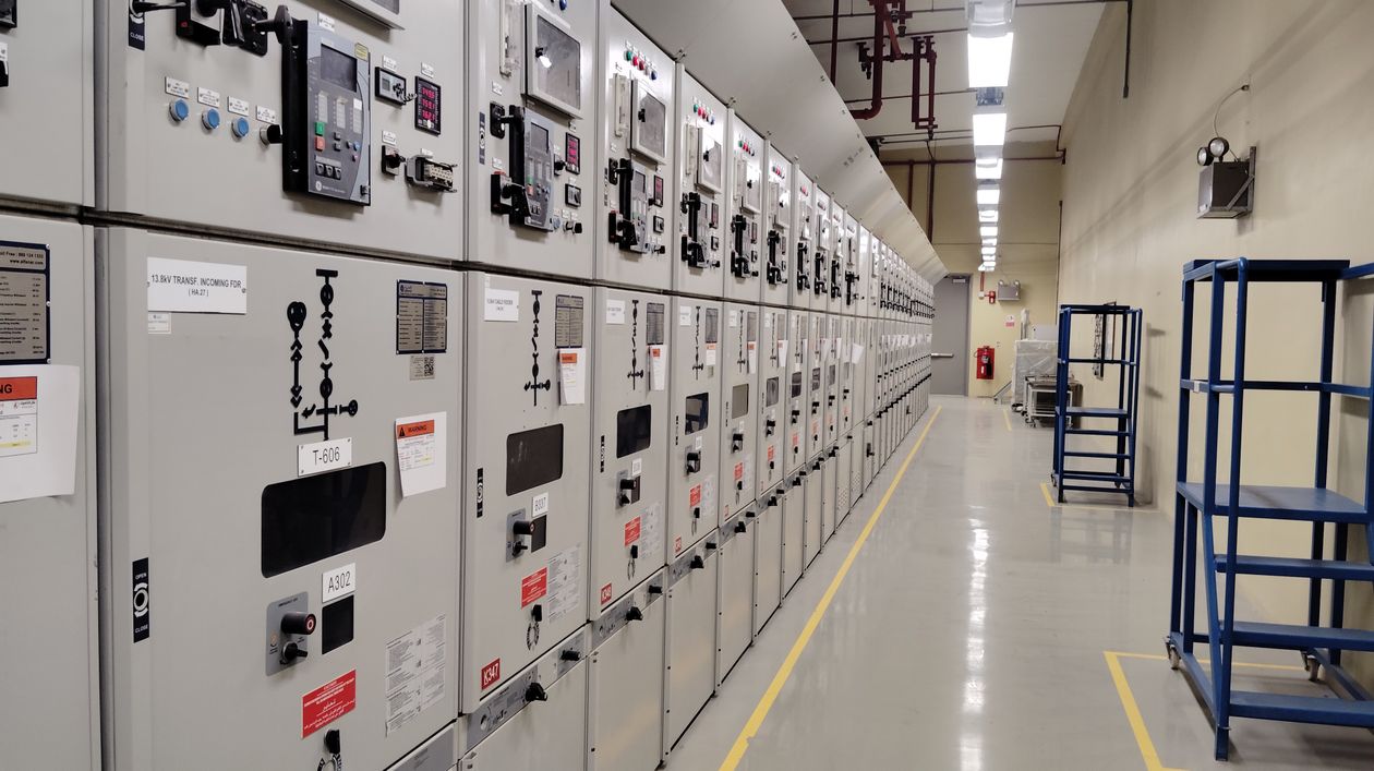 Industrial electrical control room with switchgear panels