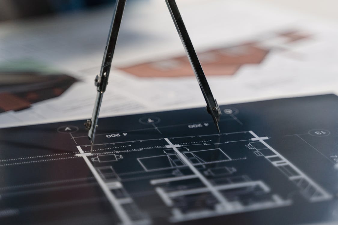 Engineers reviewing blueprints on construction site